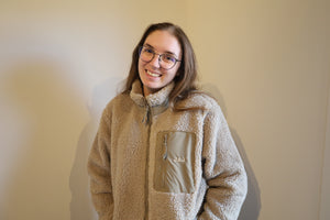 Sherpa jas met initialen