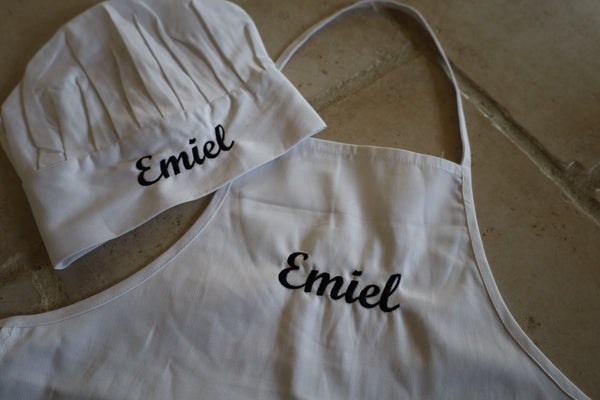 Kinderschort en koksmuts met naam