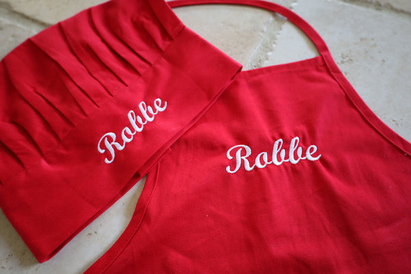 Kinderschort en koksmuts met naam