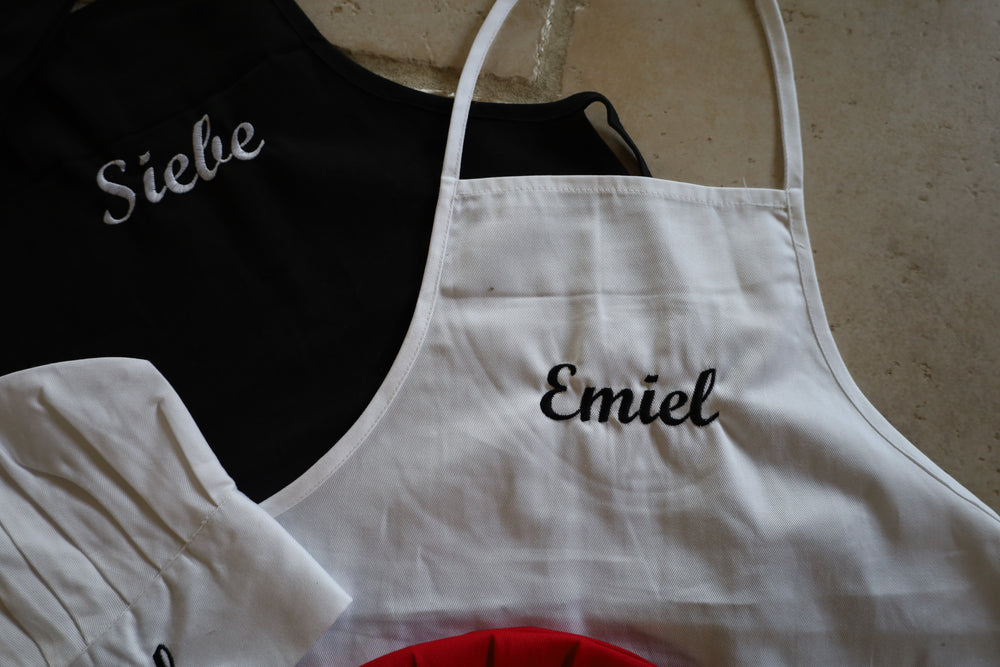 Kinderschort en koksmuts met naam