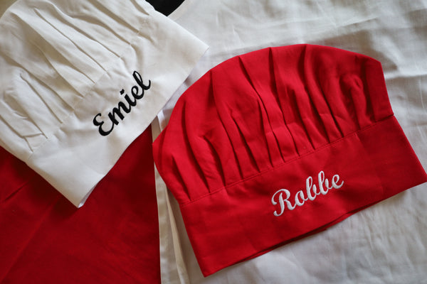 Kinderschort en koksmuts met naam